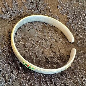 Elegant Silver Cuff Bracelet with Green and Red Accents